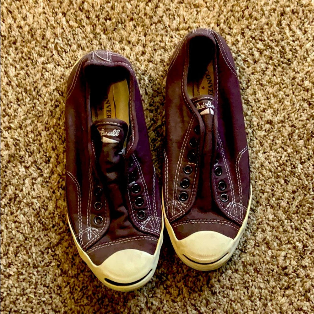 Dark maroon sneakers.